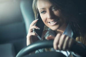 Smiling driver woman in the phone